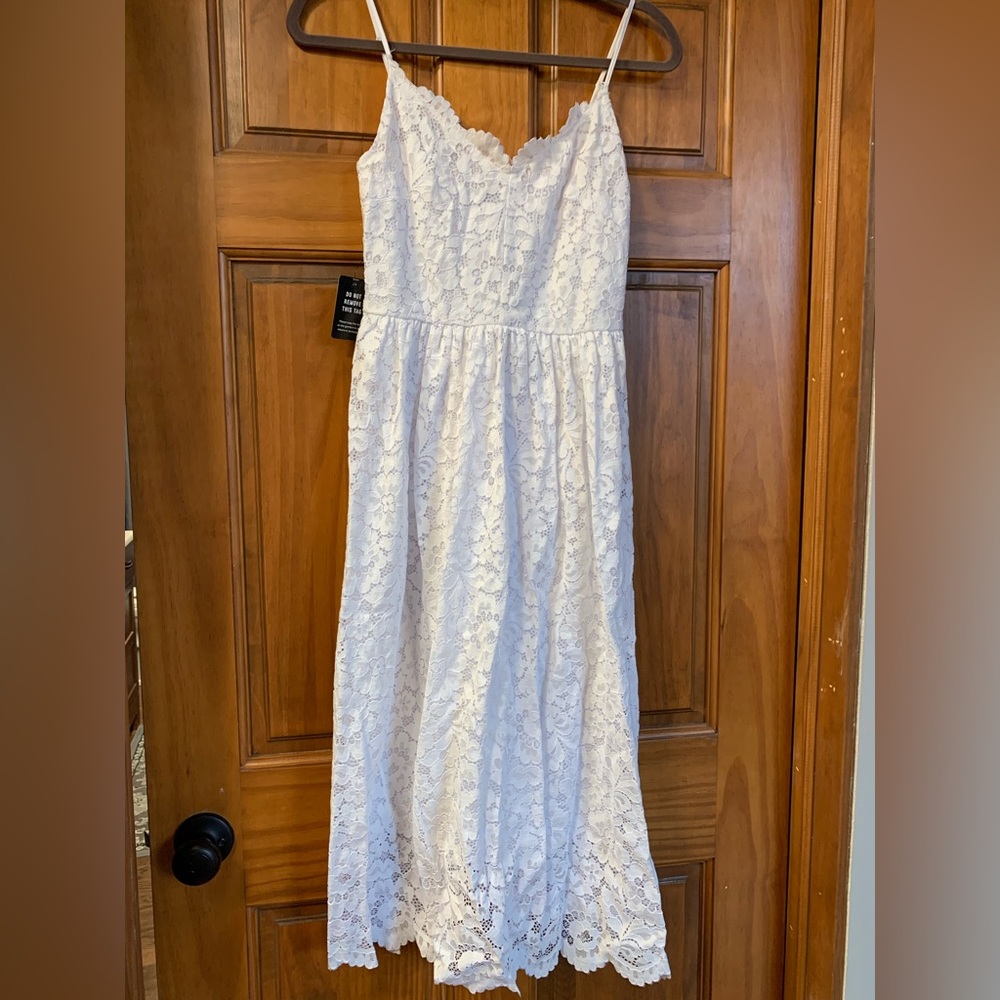 Express size small white lace midi dress with adjustable spaghetti straps. NWT